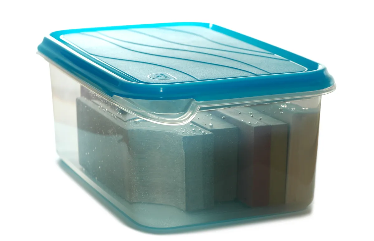 Sharpening stone soaking in a container of water